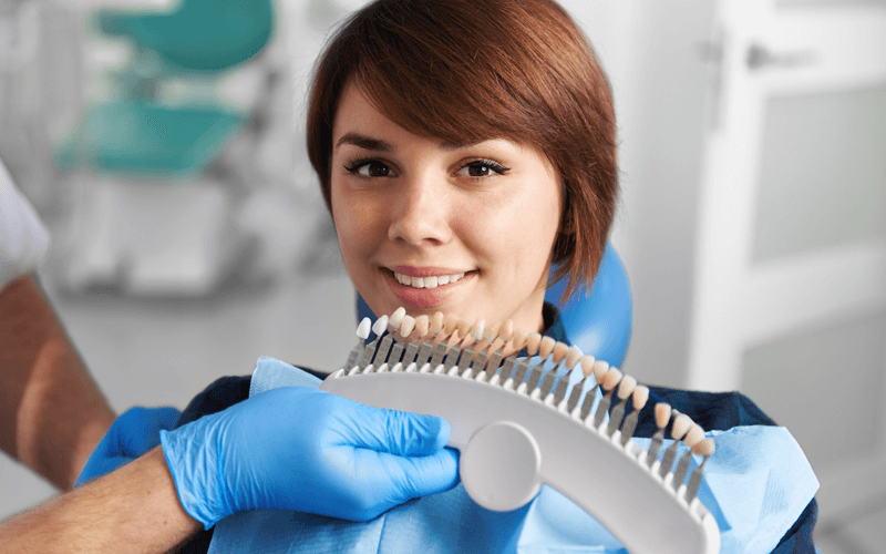 Woman at Dentist for Teeth Whitening and Bleaching